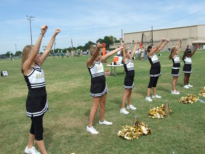 Image: Working hard — IYAA A-Team Cheerleaders do a cheer in Scurry-Rosser.