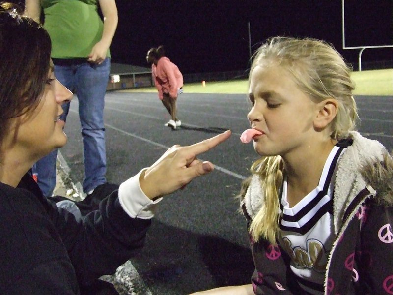 Image: Aaahh, season’s over — Cheer Coach Debra Perry goofing around with her daughter and IYAA A-Team Cheerleader Annie Perry.