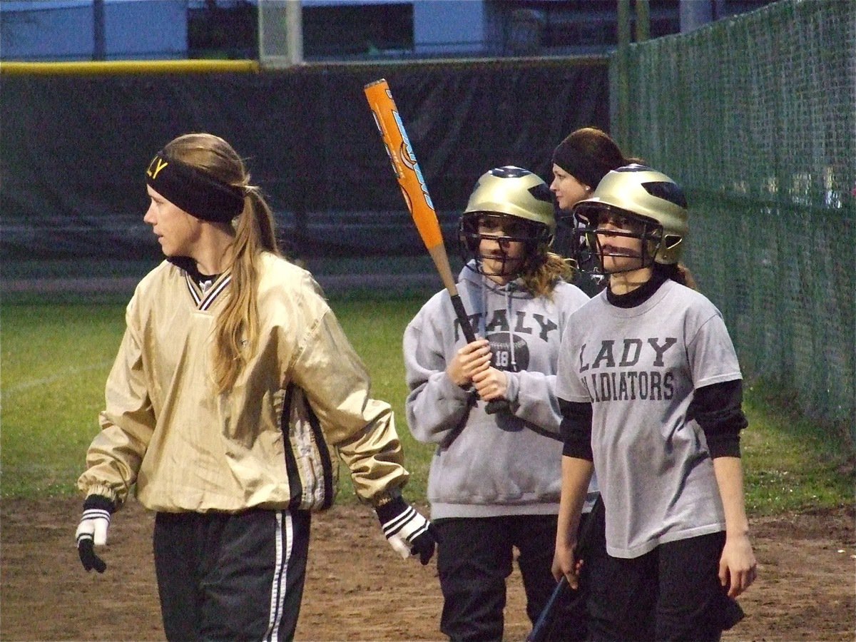 Image: Come see me — Head coach Jennifer Reeves invites her hitters to come visit her at 3rd base.