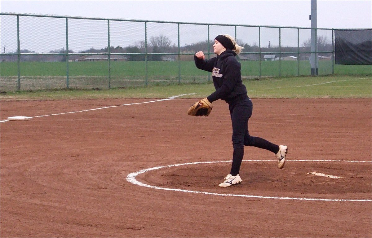 Image: Westbrook gets loose — A diamond is a girl’s best friend. Pitcher Courtney Westbrook sparkles on the mound.