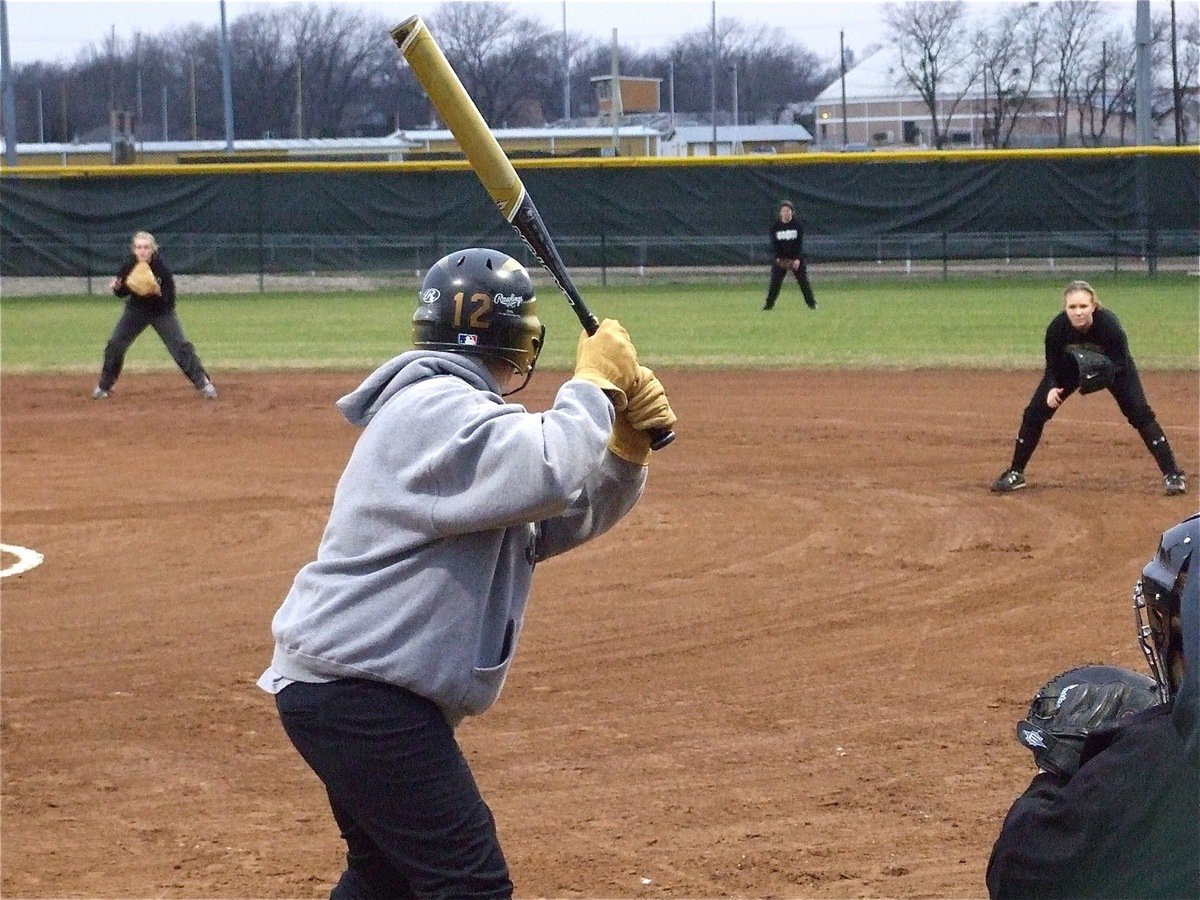 Image: McFunny! — You know your a country girl when your batting gloves double as your farm gloves. Julia McDaniel will do whatever it takes to get a win.