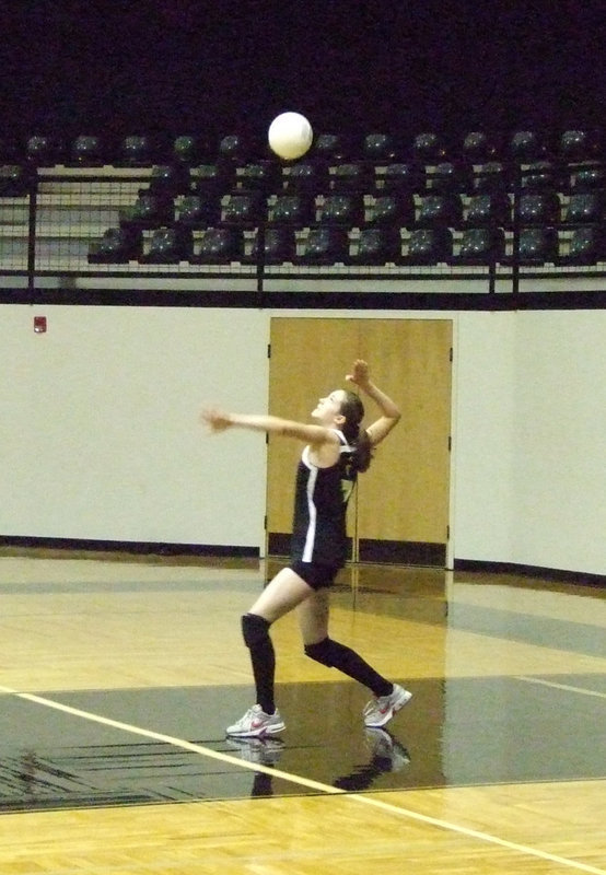 Image: Smithey serves — Melissa Smithey was pulled to Varsity mid-season.