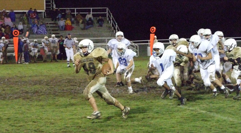 Image: Bailey Walton(48) breaks away from a pack of Bulldogs — With 0:59 left in the game, Bailey Walton(48) stripped the ball from a Wortham Bulldog running back and rumbled 45-yards for Italy’s only score of the night.