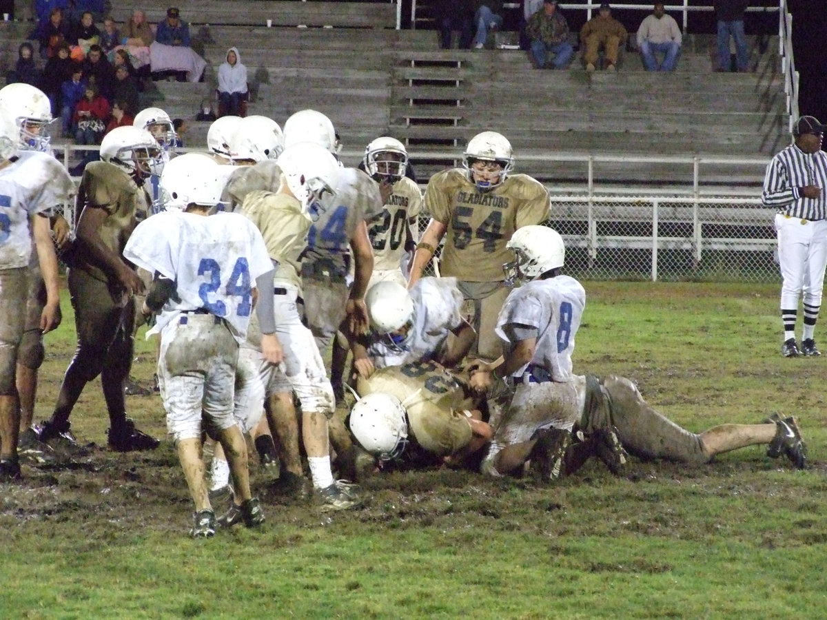 Image: Cody up the middle — Medrano tries to gain yards between the Bulldog’s defensive ends.