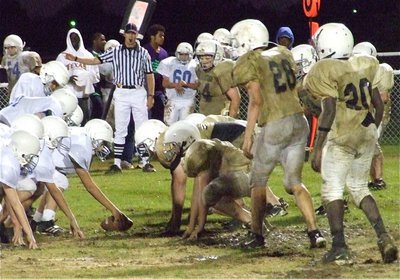 Image: Who wants it? — Italy’s Junior High defense digs in against the Wortham Bulldogs.