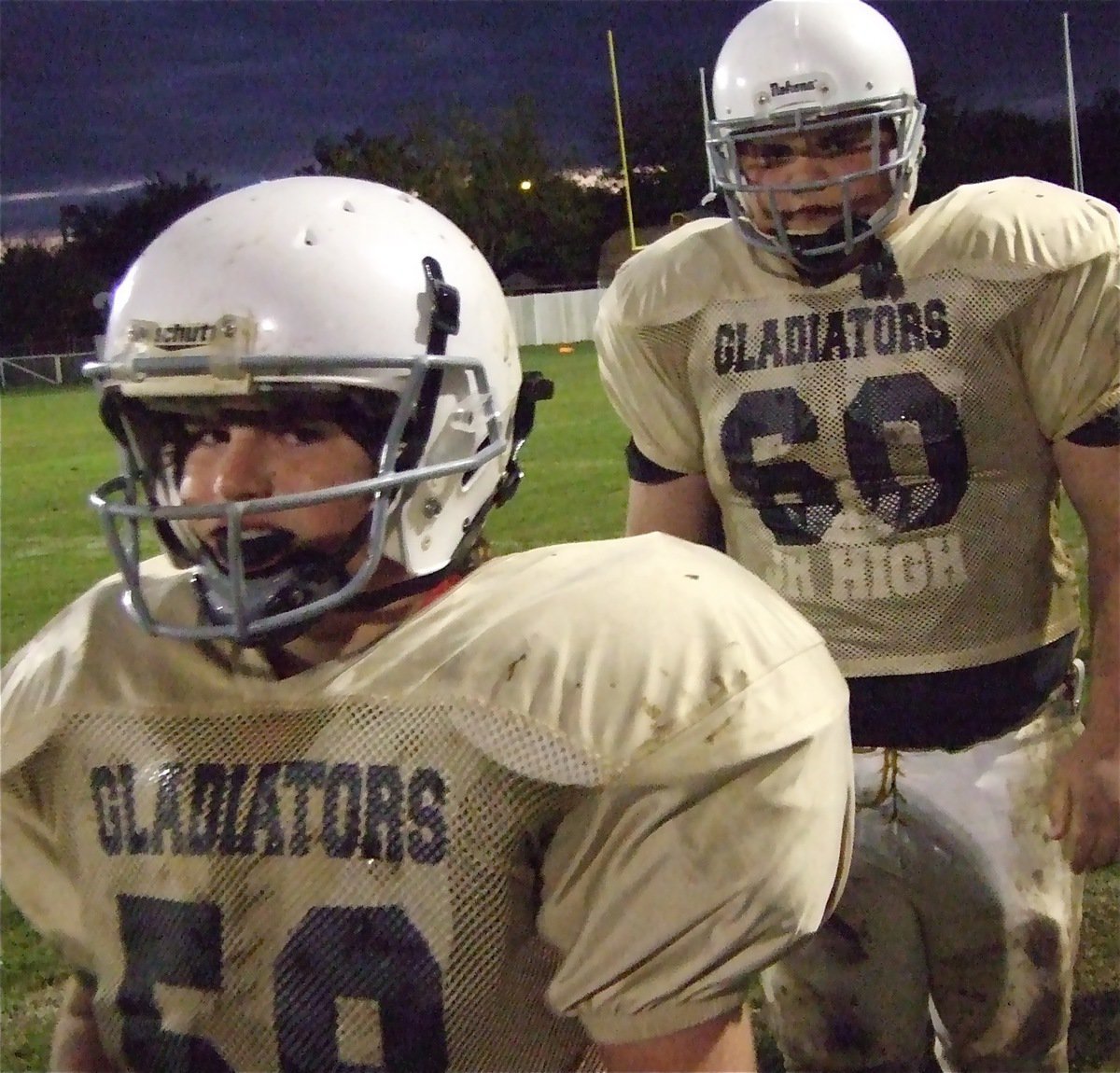 Image: Kyle and Hank — Kyle Fortenberry(58) and Hank Seabolt(60) come off the field.