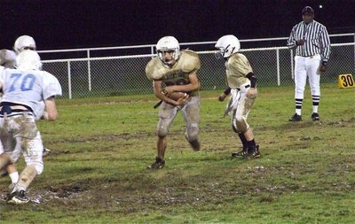 Image: Cody covers ball — Cody Medrano takes the handoff from J.T. Escamilla against Wortham.