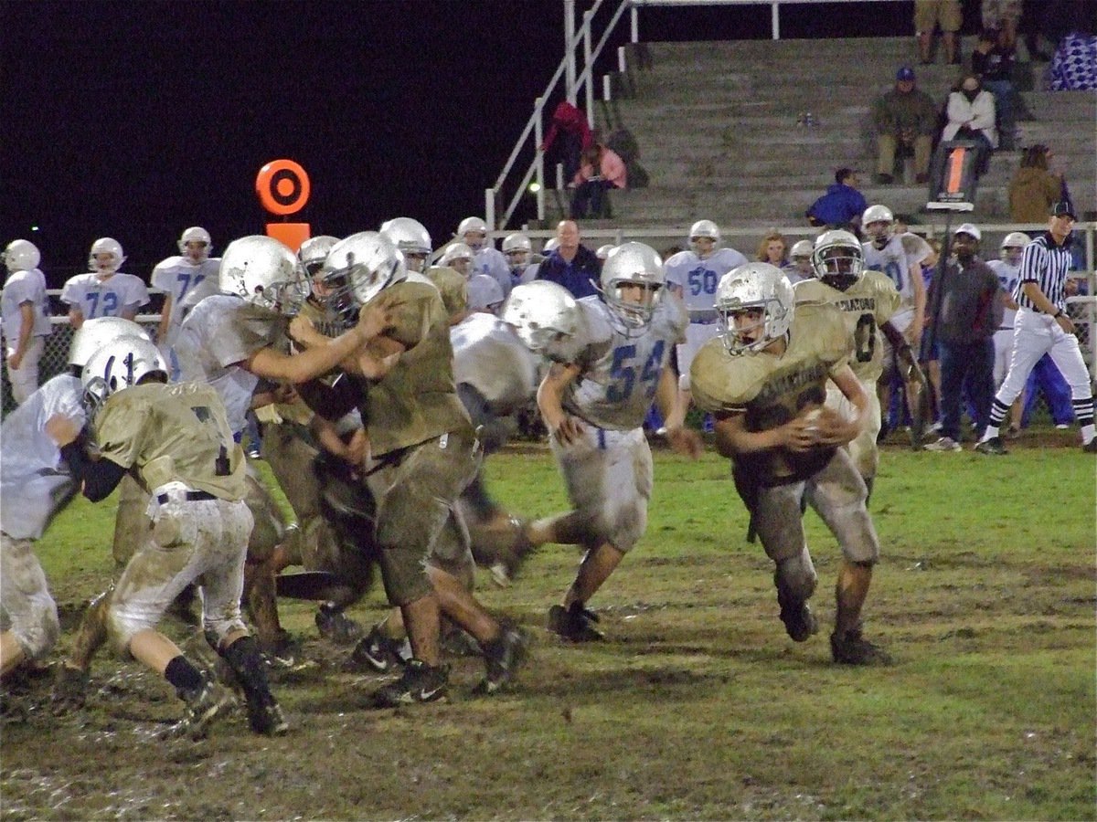 Image: Cody runs — Medrano follows his blocking around the end.