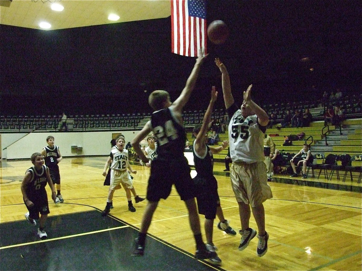 Image: Kelton Bales shoots — Kelton Bales(55) takes a baseline jumper over Palmer’s big man.