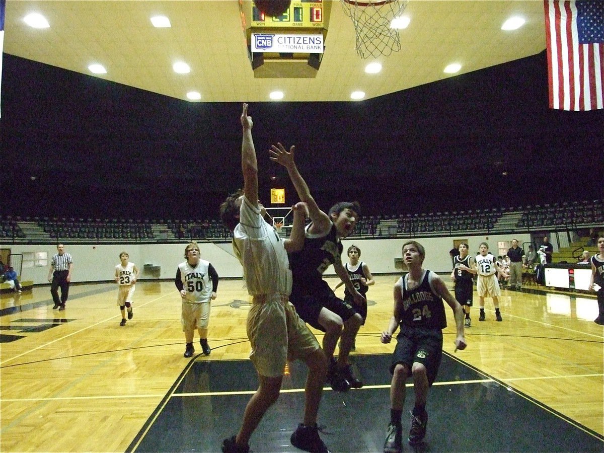 Image: Chace has no fear — Chace McGinnis tries to finish the fast break before being attacked by a Bulldog.