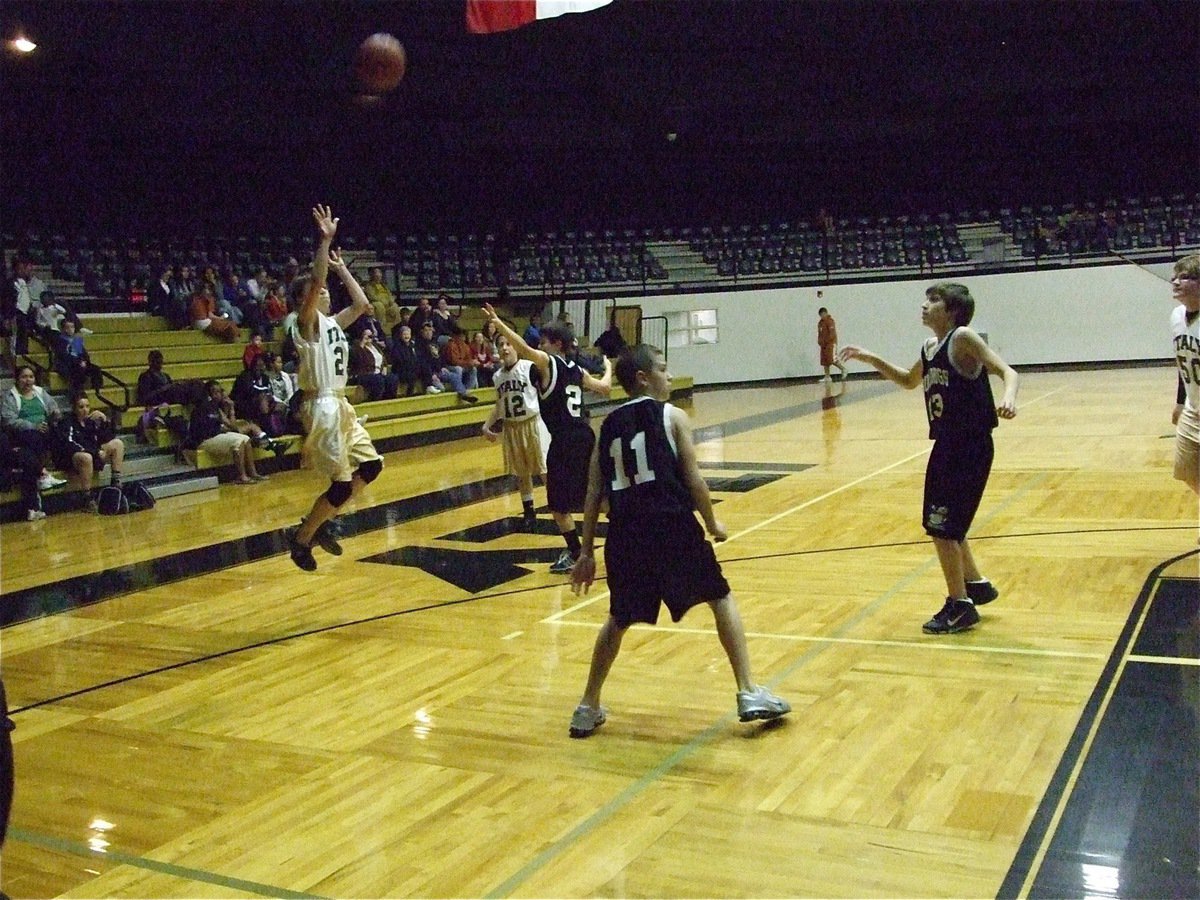 Image: Colton shoots — Colton Petrey(23) leaps into a 3-point shot against the Palmer defense.