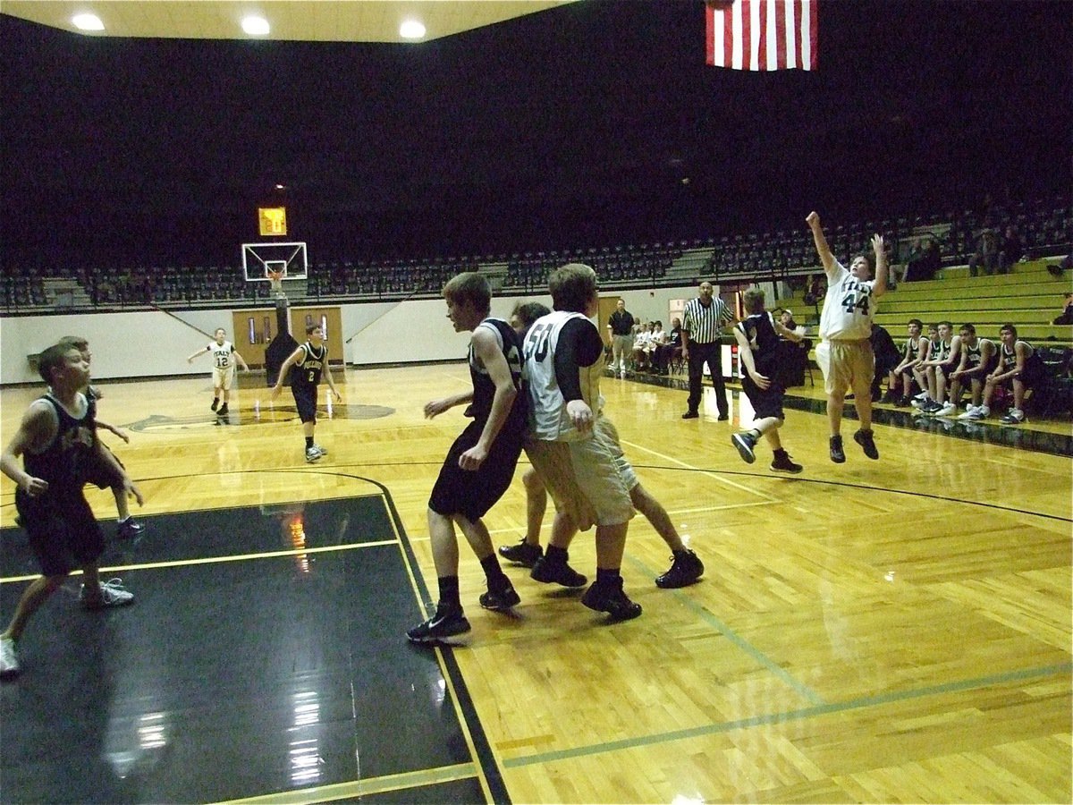 Image: Byers delivers a shot — John Byers(44) tries to punch into the Palmer lead while Tyler Vencill(5) posts up down low.