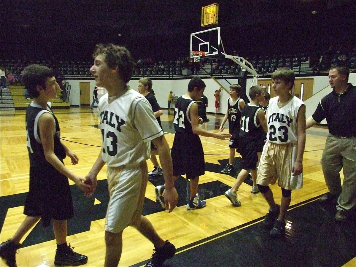 Image: Nice game! — Chace McGinnis(13), Colton Petrey(23) and coach Josh Ward shake hands with Palmer’s players after the game.