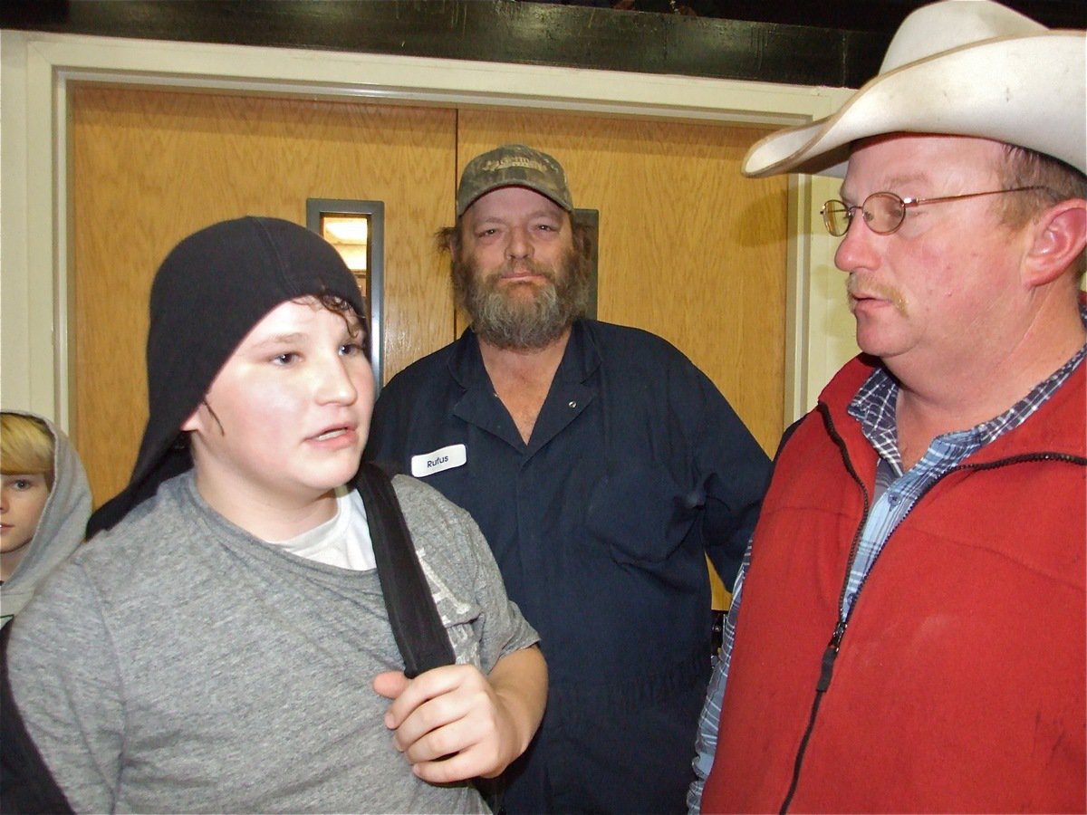 Image: Should’ve shot more… — John Byers discusses the game with his father, Brent Byers (Red Jacket) and friend T.J. Schrotke.