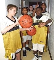 Image: 8th graders get set — Charging out of the tunnel, wearing white trunks with an old gold stripe, are your 8th grade Gladiators. This bout is scheduled for four rounds.