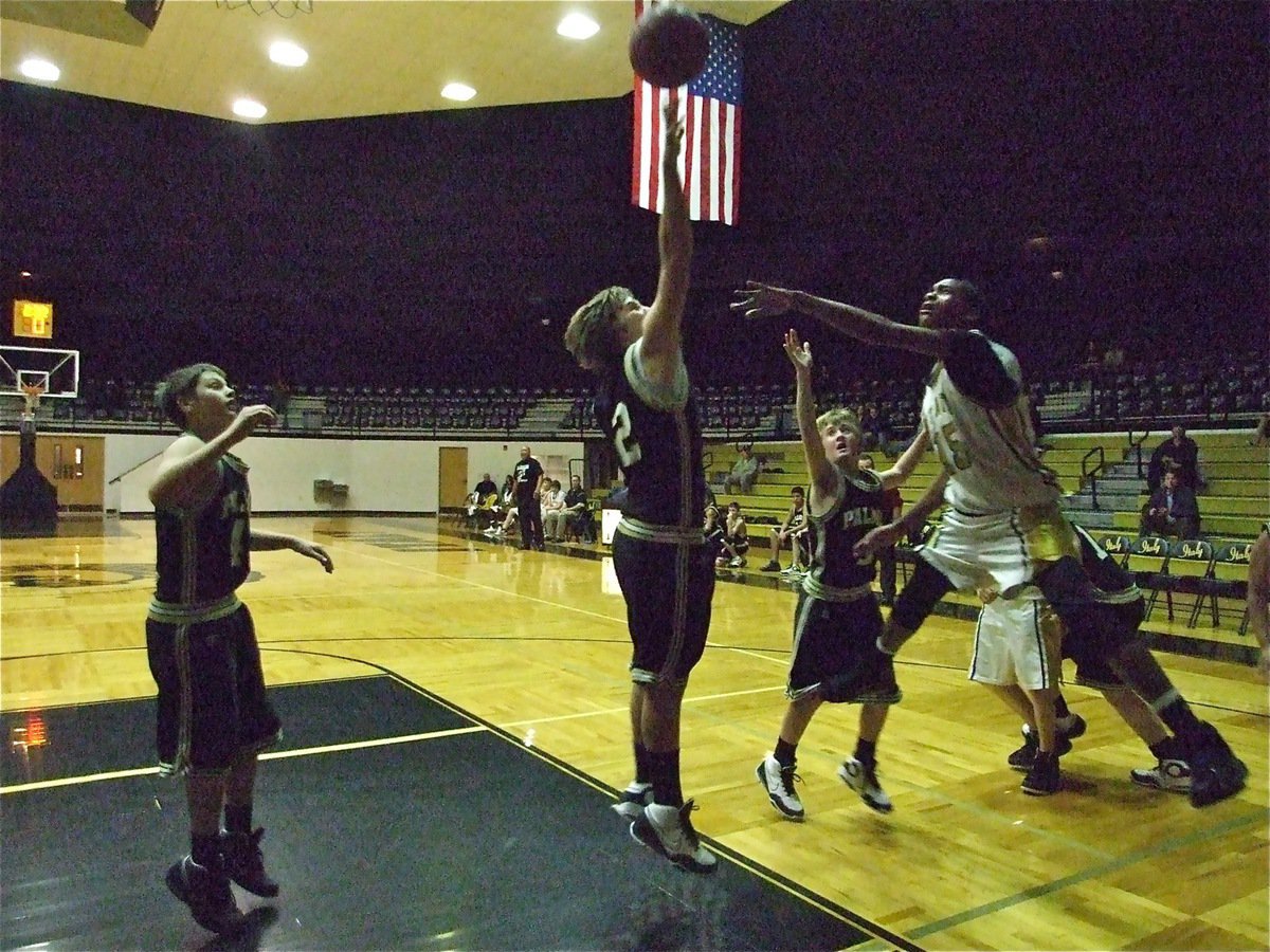 Image: Trey to pass — Treyvon Robertson(15) clears out space to get a pass away.