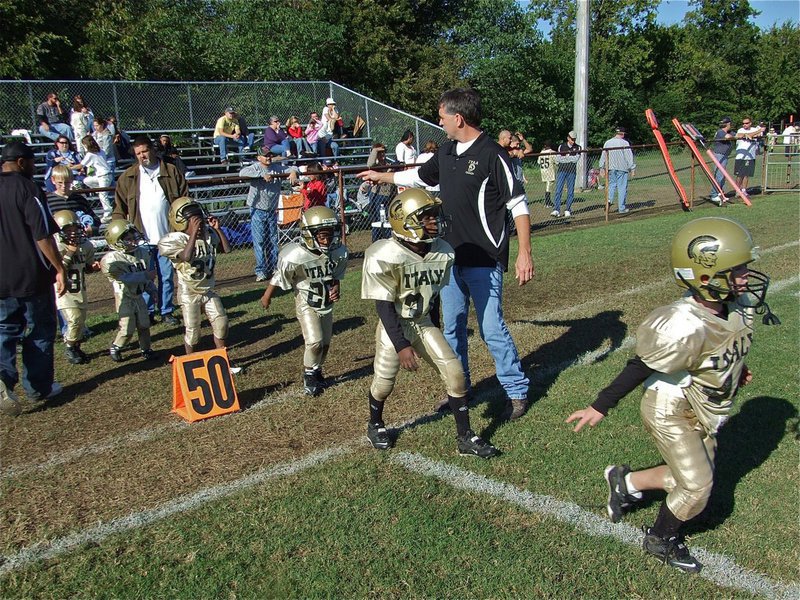 Image: C-team wins! — The C-Team coaches send their players out to shake hands, or paws rather, with the Dawson Bulldogs.