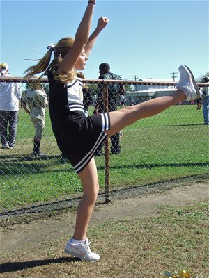 Image: Spirit kick — Brooke DeBorde high kicks during the game.