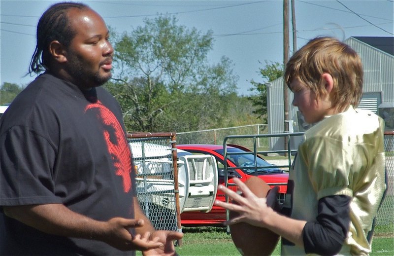 Image: Munchie and Maynard — Shedrick Anderson offers some advice to Austin Maynard at halftime.