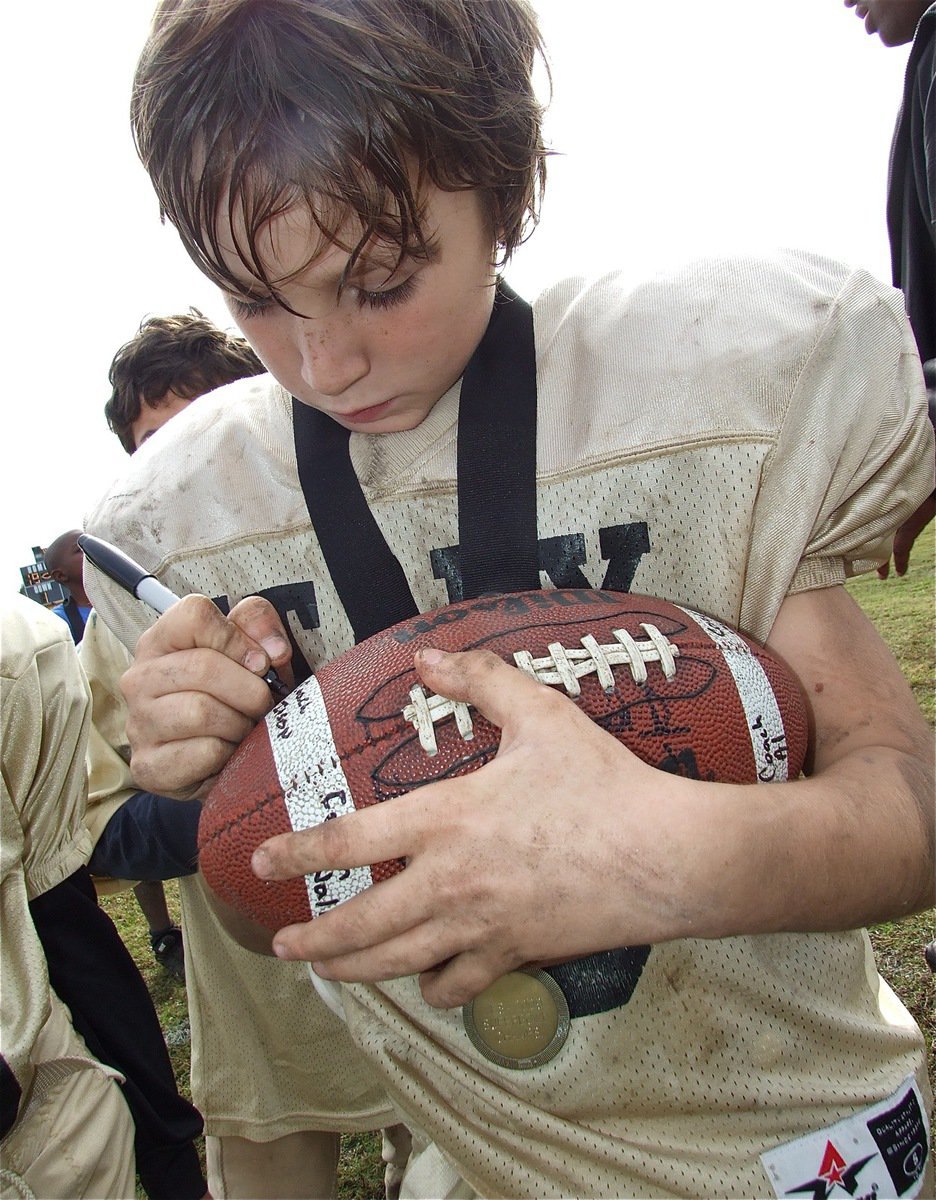 Image: Ryder signs game ball