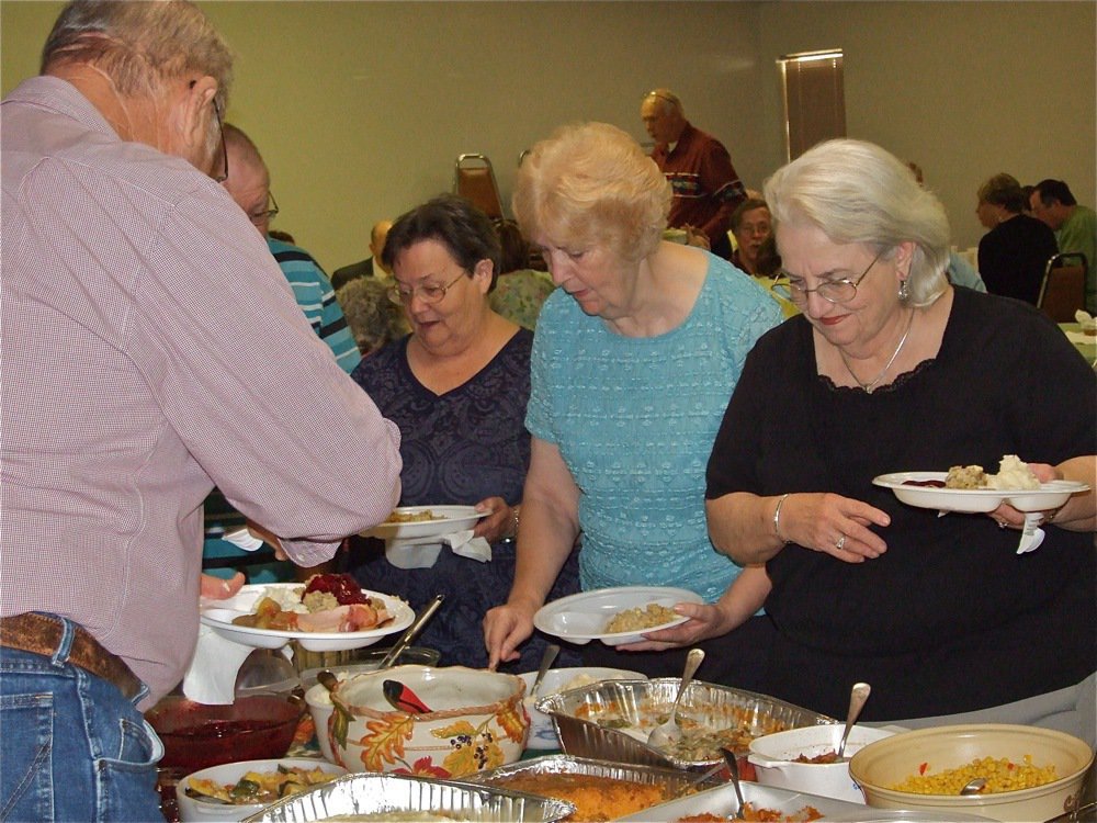 Image: With all the trimmings  — The menu included turkey and dressing, ham, sweet potatos, beans, corn, rolls, and a variety of salads and deserts.