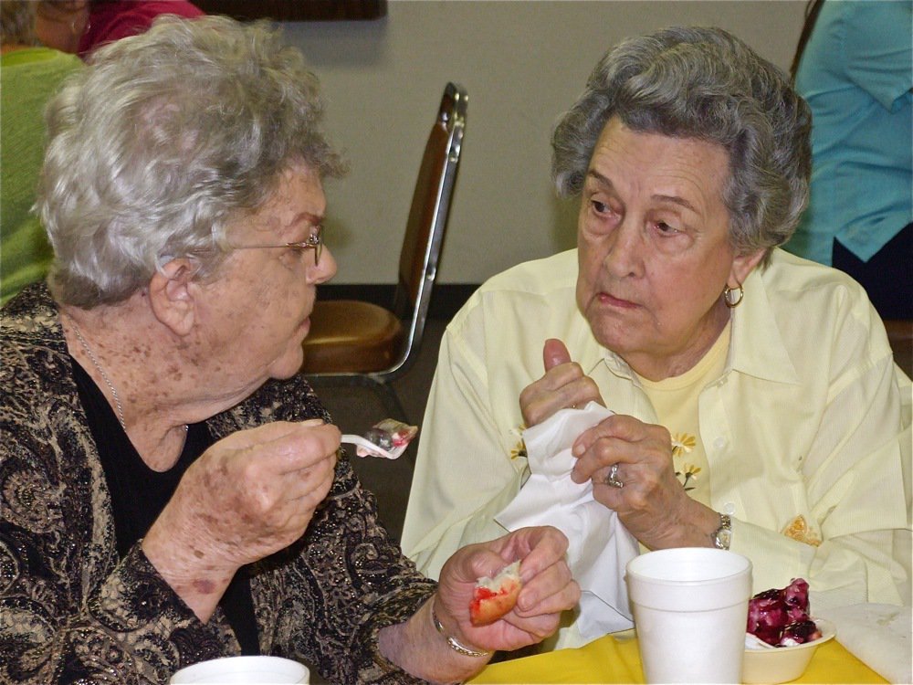 Image: This is delicious! — Enjoying fine food warm the conversation at the Central Babtist Church Luncheon.