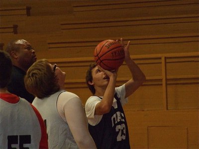 Image: Be the ball… — Coach Larry Mayberry gives Chase McGinnis(23) some advice on shooting from the block.