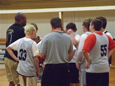 Image: Way to work! — Coach Mayberry and Coach Ward huddle with the 7th graders after practice.