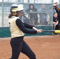 Image: Alma Suaste — Lady Gladiator Alma Suaste(7) swings for the fences against Blooming Grove.