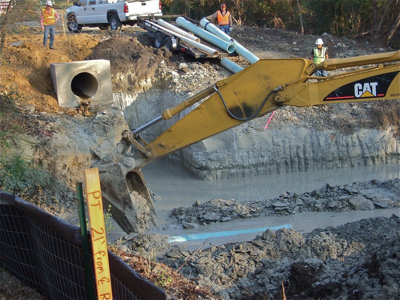 Image: Just add dirt — The pipes get covered with earth.