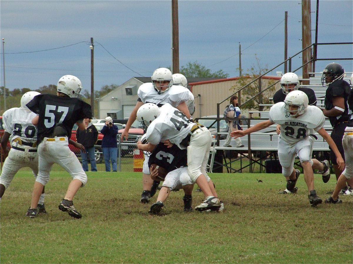 Image: Baily Walton(48) pounds a Dawson Bulldog runner — Italy’s offense put 6-points on the board first but Dawson tied the game before halftime, and that’s how it would end, in a 6-6 tie.