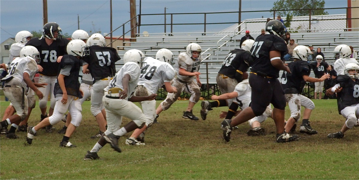 Image: Need a bigger leash — The Gladiators track a Bulldog runner.