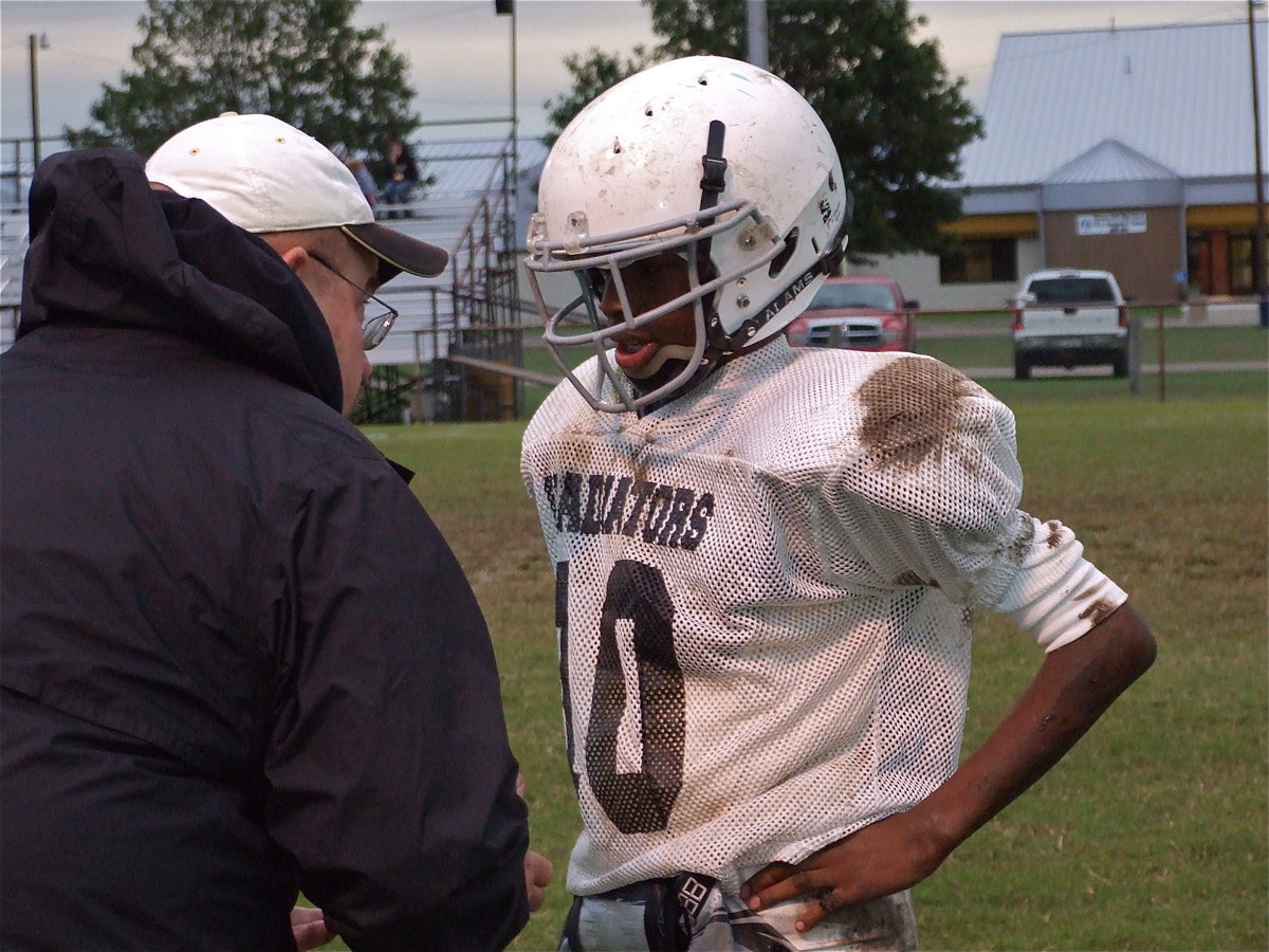 Image: Be the ball… — Coach Robert Sollers offers advice to quarterback Eric Carson. Carson scored the only touchdown for Italy during the game.