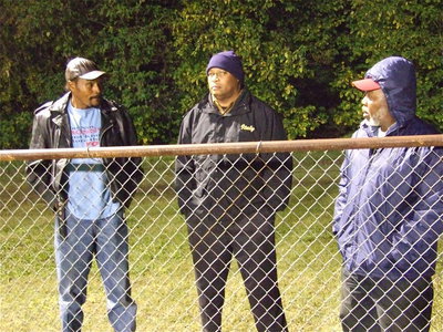 Image: Fence fanatics — Bang, Larry and Erwin enjoy the game.
