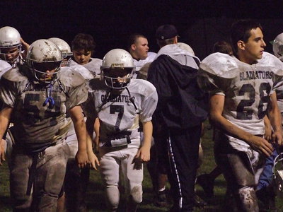 Image: Load up! — The Italy JH Gladiators head for the bus after playing Dawson to a tie, 6-6.
