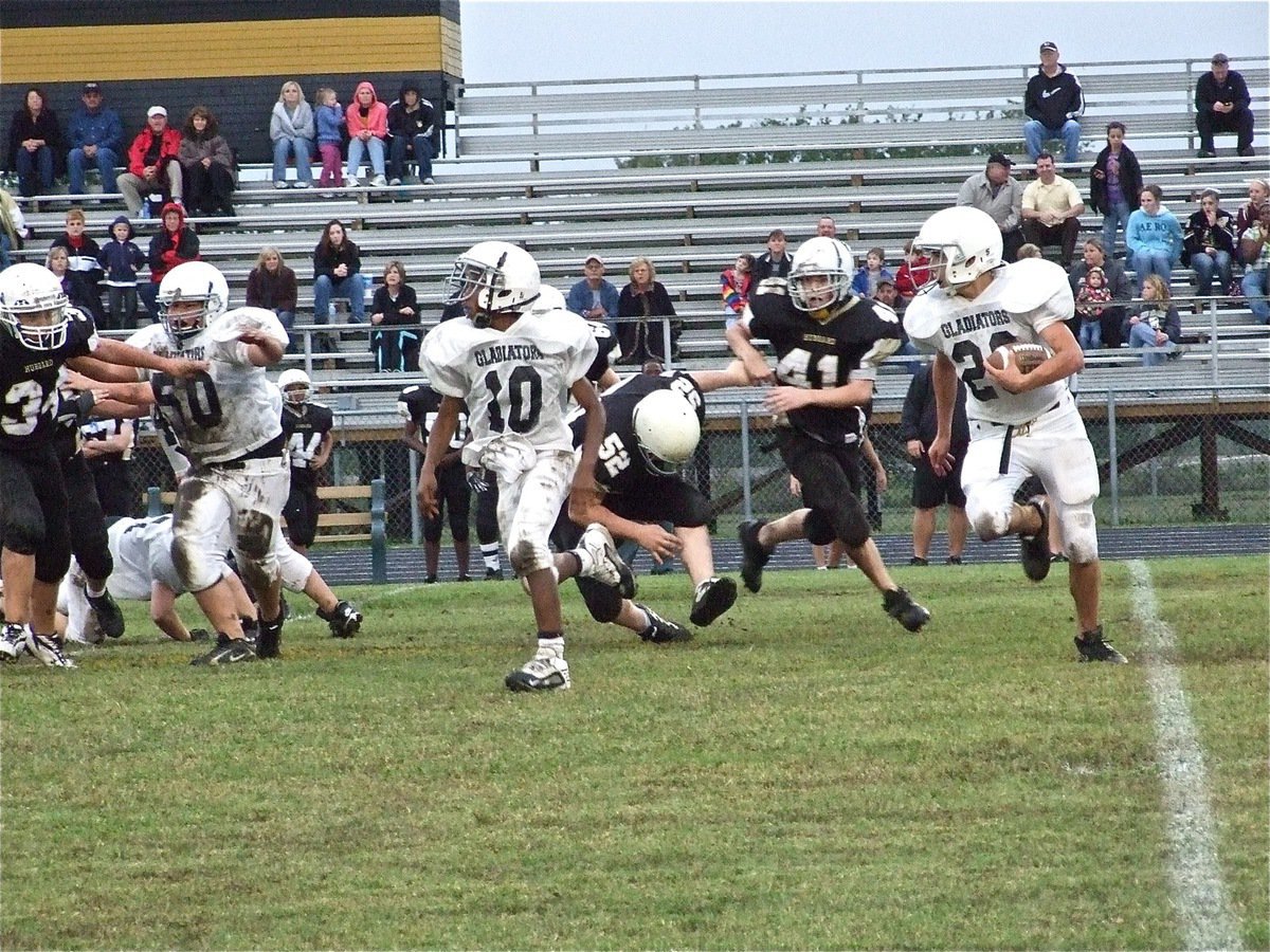 Image: Cody Medrano(28) helped Italy’s Junior High knockout the Jaguars — Eric Carson(10) lead blocks for Cody Medrano(28) as Italy pulls off a heavy-weight upset over the Hubbard Jaguars, 26-6. The win establishes the Gladiators as a contender in their division as they shake-up the rankings.