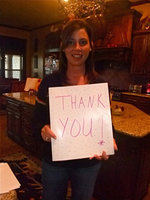 Image: Tina Haight — Tina is holding up a Thank You card made by the Stafford Elementary students. They are thanking her for her donation to the book fair.