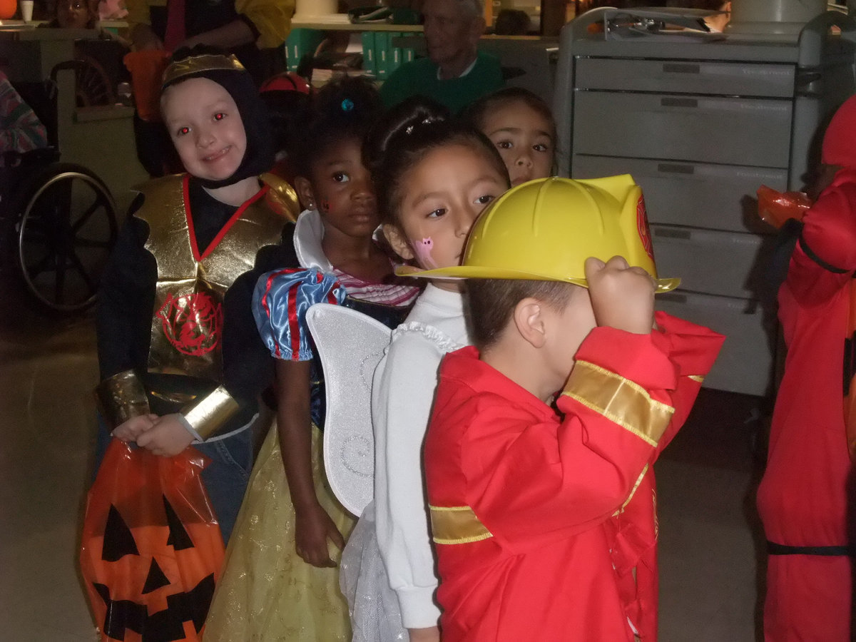 Image: Marching off to Fun — These little ones are off to collect more candy.