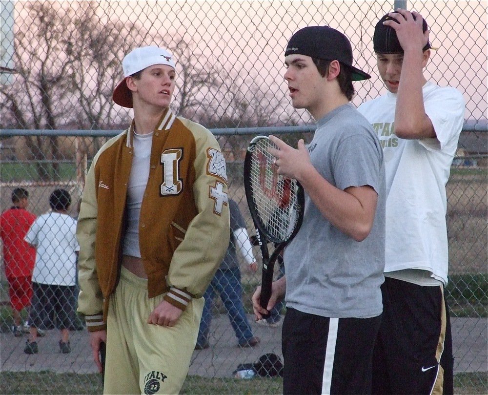 Image: Talking tennis — Can you tackle? No. Can you kick the ball? No. Do you get a homerun if you hit over the fence? No. Can you slam it? Yes! That’s cool.