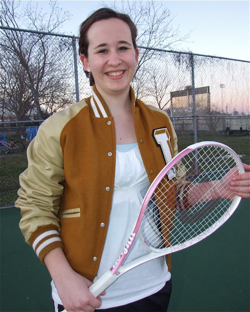 Image: Lisa Olschewsky — Rolling up the sleeves on her Gladiator letter jacket, Lisa Olschewsky gets ready to play.