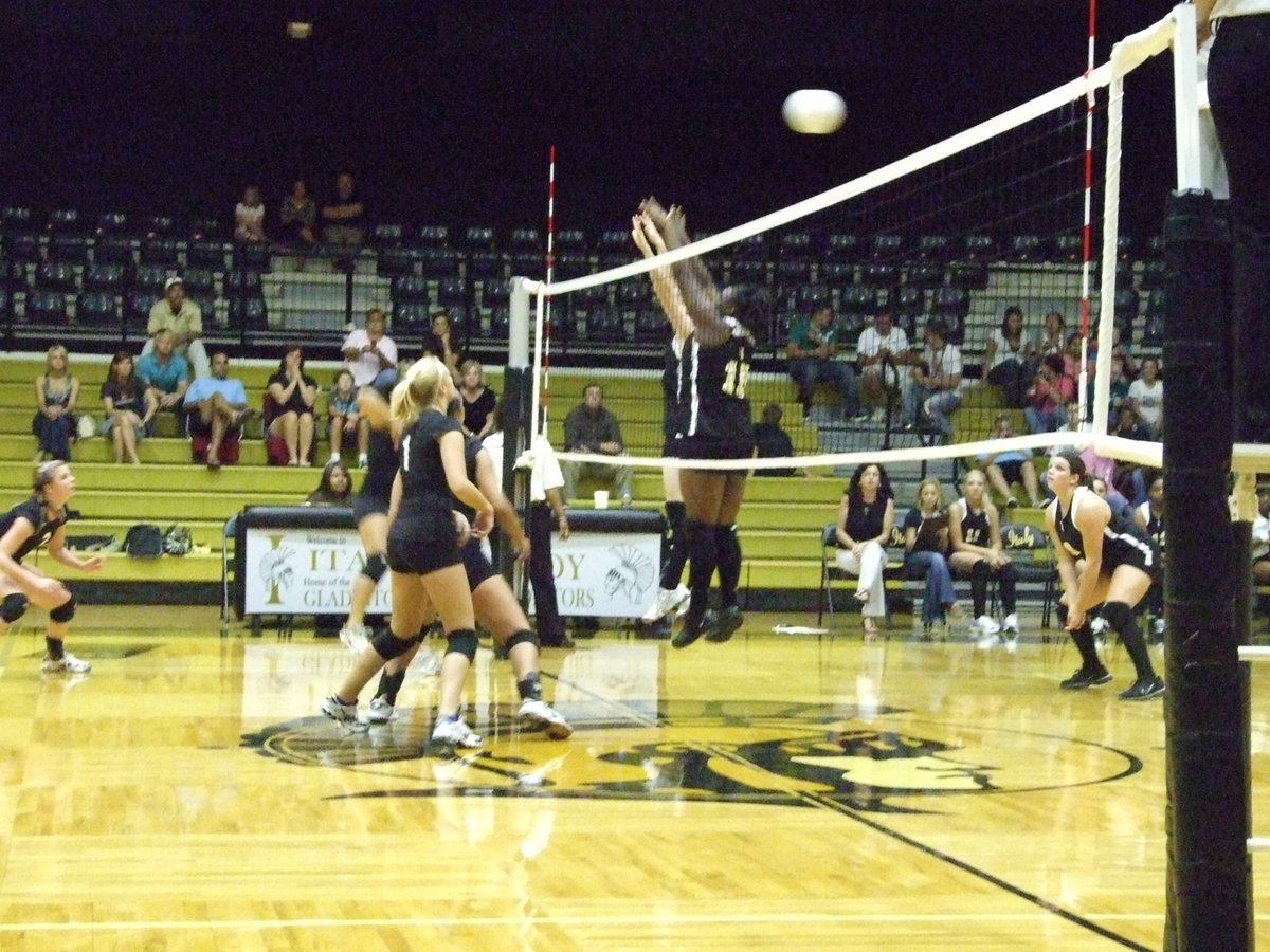 Image: Get ready, set, jump — The Lady Bulldogs get the ball past the frontline.