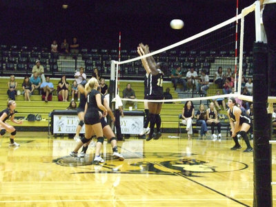 Image: Get ready, set, jump — The Lady Bulldogs get the ball past the frontline.