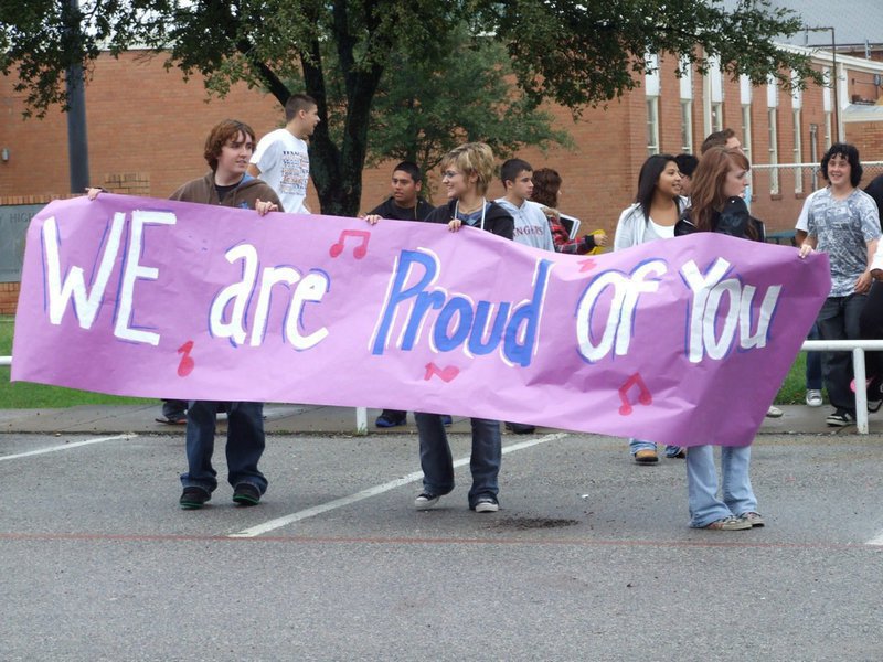 Image: We certainly are! — The IHS student body welcomes the Gladiator Regiment Band and Flag Corp home.