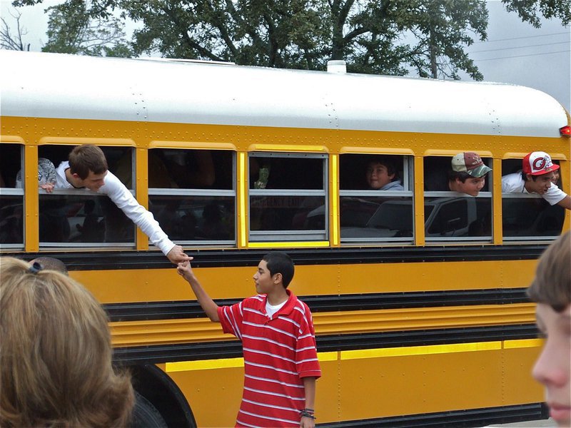 Image: Congrats! — IHS students congratulate the band members upon their arrival.