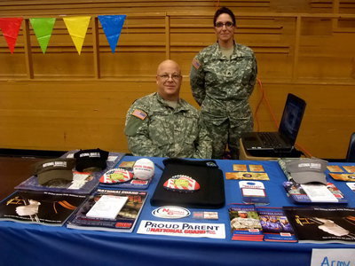 Image: Texas Army National Guard — Sergeant Adams and Sergeant Teresa Denelly heading up their booth.