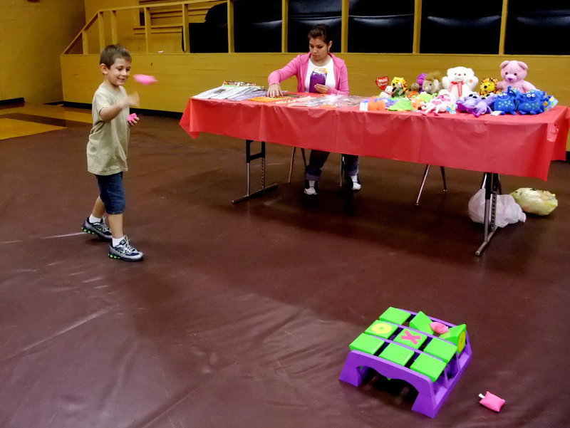 Image: Tic-Tac-Toe Toss — Garrett Everett having fun play this game.