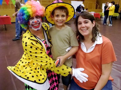 Image: Sally, Garrett and Melanie — Sally the Clown, Garrett and Melanie Everett enjoying the evening.