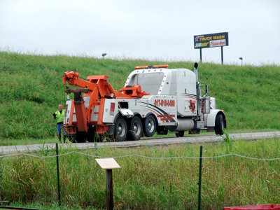 Image: Ft Worth Wrecker — This wrecking truck came to pull the ‘big rig’ out of the mud.