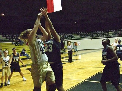 Image: Lewis goes for it — Jaclynn Lewis(41) works the low block against the Lady Lions.