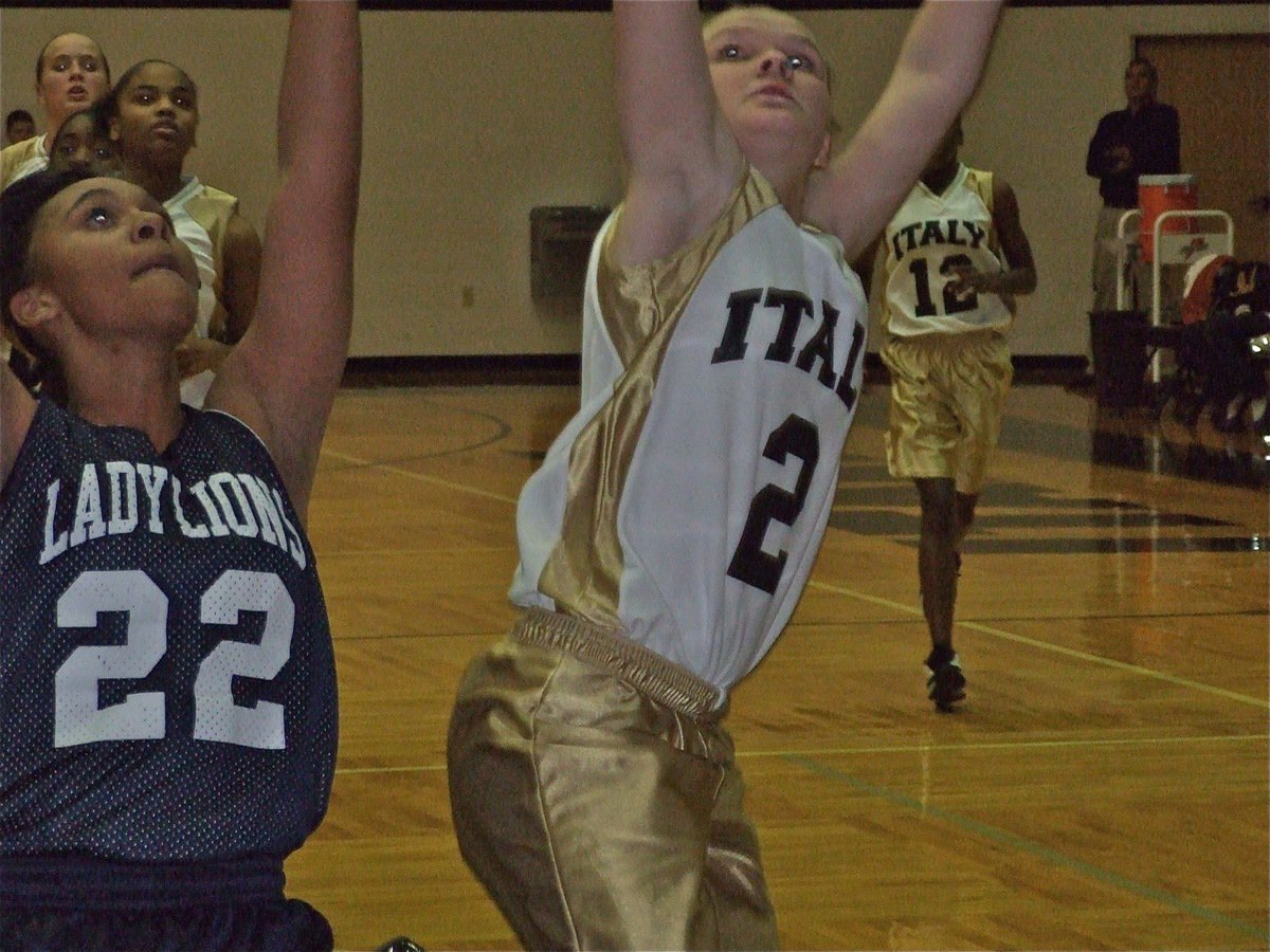 Image: Tara scores — Tara Wallis(2) finishes off the fastbreak.